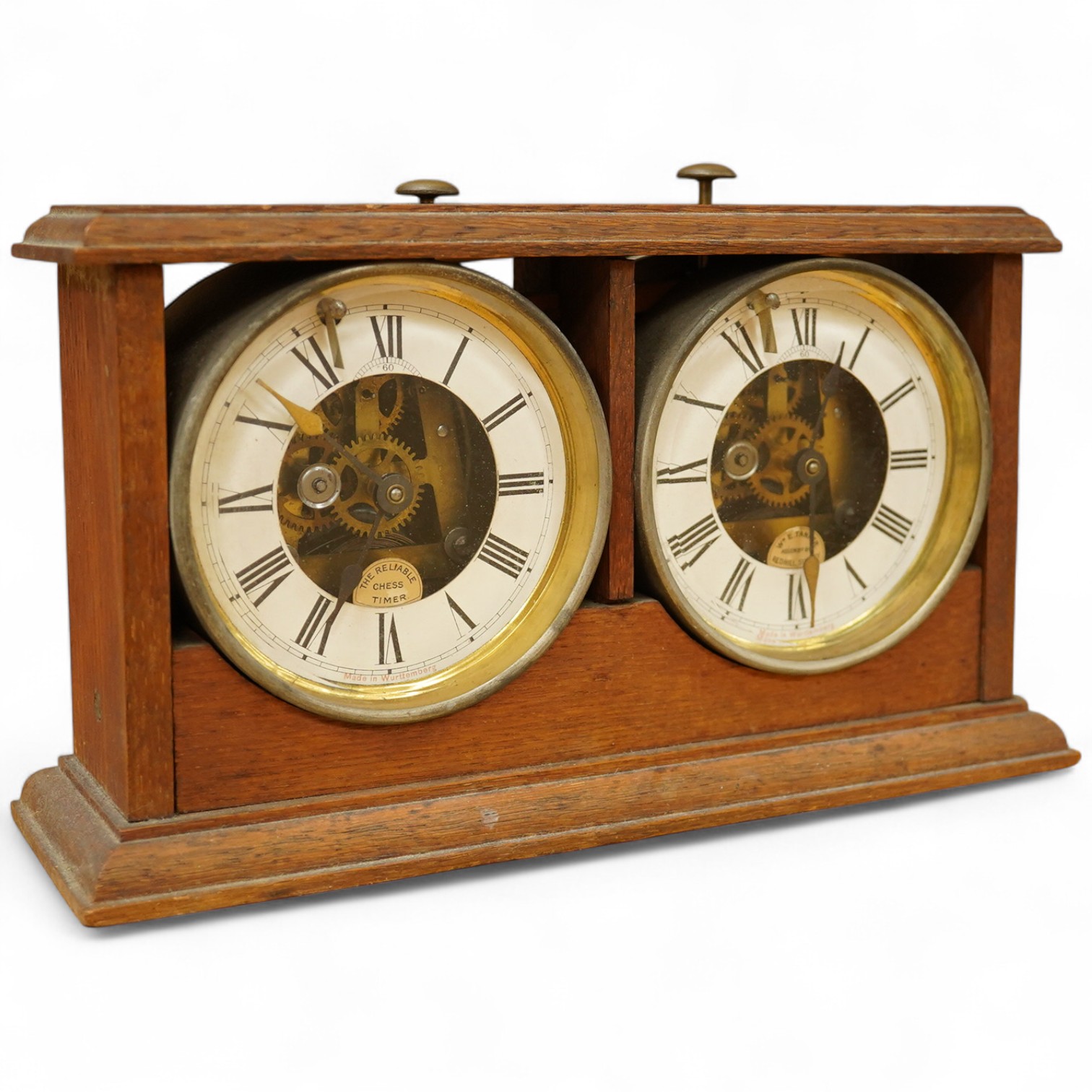 A William Tanner 'The Reliable Chess Timer' in an oak case, stamped to the reverse ‘HAO Make, Made in Wurttemberg’. Condition - fair to good.